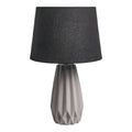 **Lampe de table en céramique avec abat-jour en tissu noir**